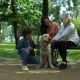 Positive Family Resting in the Park with Their Dog - VideoHive Item for Sale