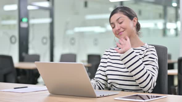 Cheerful Indian Woman Doing Video Chat on Laptop 