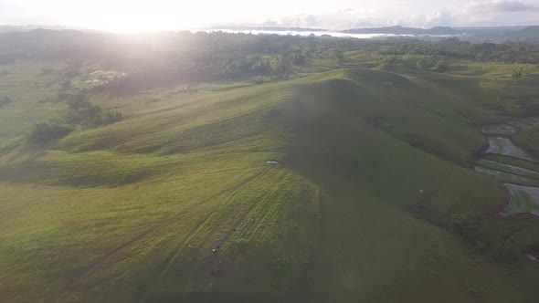 Aerial View of Rural Grassland in the Philippines with Sunrise