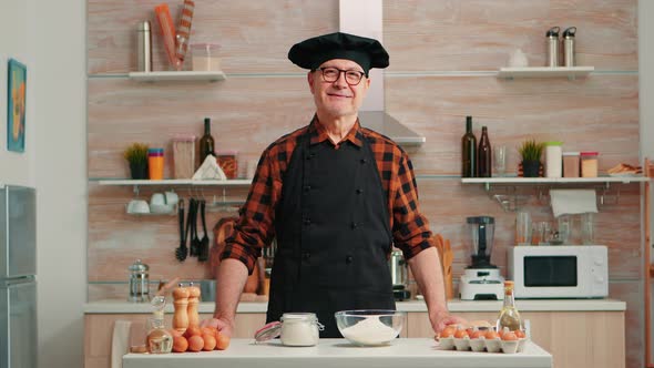 Portrait of Chef Wearing Bonete Looking at Camera