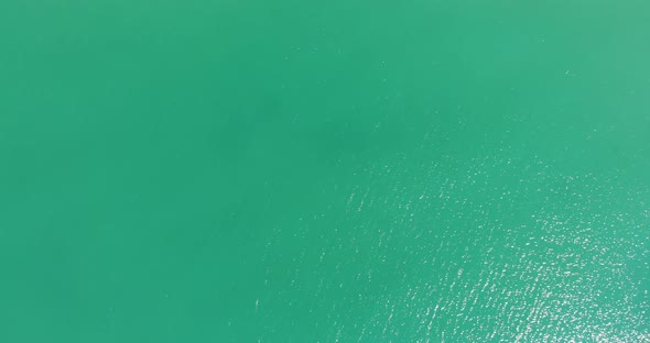 Top Down View Of Turquoise Water Of The Ocean