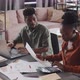 Man and Woman Doing Taxes - VideoHive Item for Sale