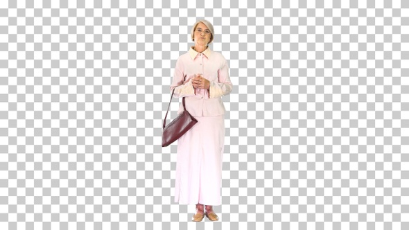 Old woman lady in pink dress standing and waiting, Alpha Channel