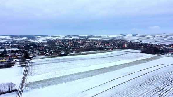 Snow-covered Empty Vineyards Near Zistersdorf Neighborhood At Winter In Lower Austria. - aerial