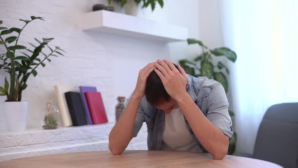 Thoughtful Serious Young Man Student Writer Sit at Home Office Desk with Laptop Thinking