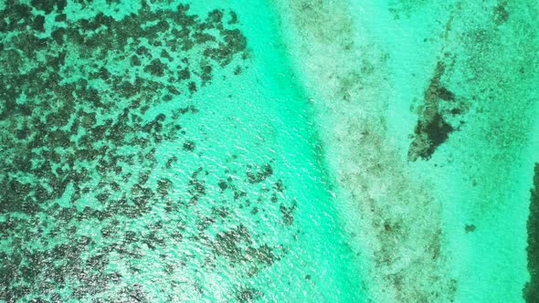 Aerial drone texture of paradise seashore beach adventure by blue water and white sandy background o