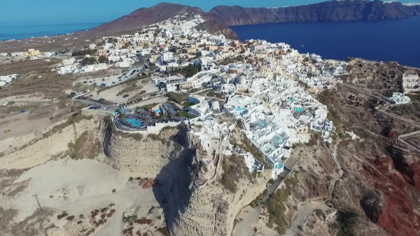 Santorini Aerial View Video of Greek Island with White Houses and Blue Roofs on Sunset and in the