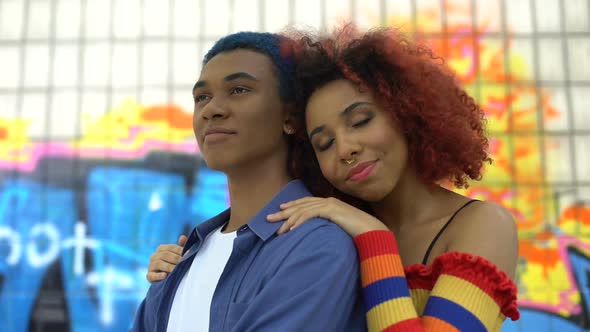 Red-Haired Female Teenager Hugging Boyfriend Graffiti Wall Background, Culture