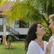Couple Walking Embracing In Tropical Garden Near Villa House, Happy Man And Woman Kissing Outdoors - VideoHive Item for Sale