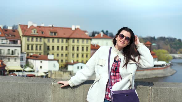 Medium Shot Charming Tourist Woman Smiling Relaxing Standing on Embankment European Beautiful City