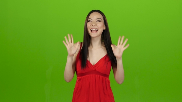 Girl Received a Big Win, She Is Happy with Her Victory. Green Screen