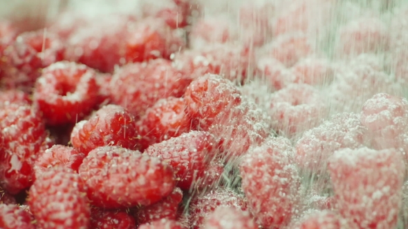 Pots of Sugar Pour on Juicy Raspberries