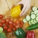 Woman's Hands Slicing Sweet Red Bell Pepper on a Wooden Cutting Board - VideoHive Item for Sale