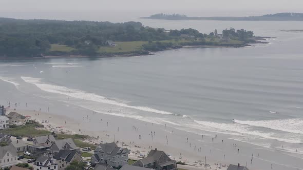 Drone shot of people enjoying Higgins Beach in Maine.