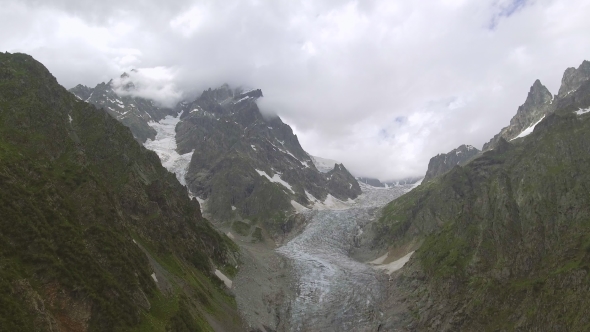 Flying Over Glacier Valley in Svaneti Rocks. Snow Peak in Caucasus, Georgia