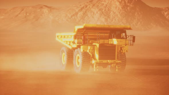 Big Yellow Mining Truck in the Dust at Career alt