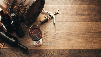 corkscrew on a rustic wooden table: traditional winemaking and wine tasting concept