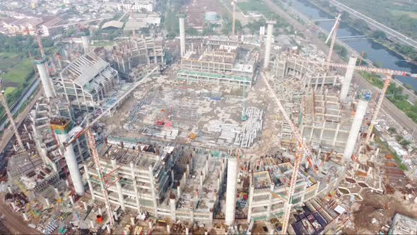 Foggy aerial view of the construction of a football stadium