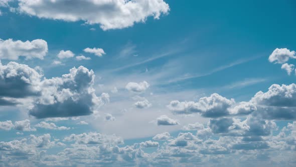 Clouds Float Across the Blue Sky in Shuttles Shape Timelapse