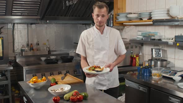 Portrait Of Chef With Prepared Dish