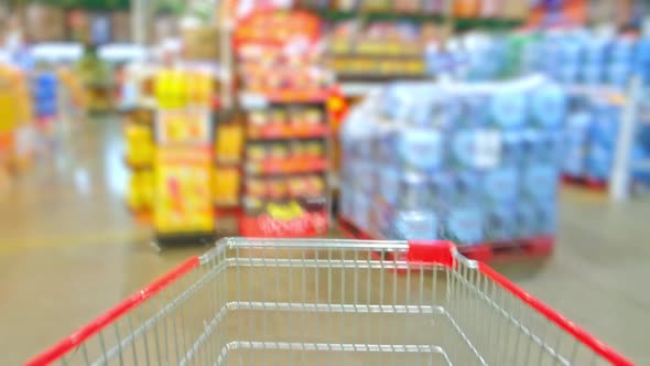 4K : Time lapse of shopping cart moving through supermarket