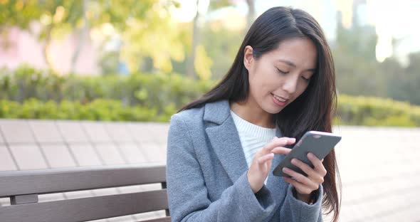 Business woman using mobile phone at outdoor