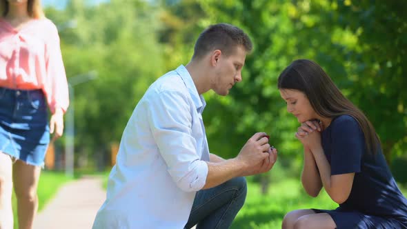 Naive Girl Admiring Wedding Ring While Her Boyfriend Looking at Another Woman