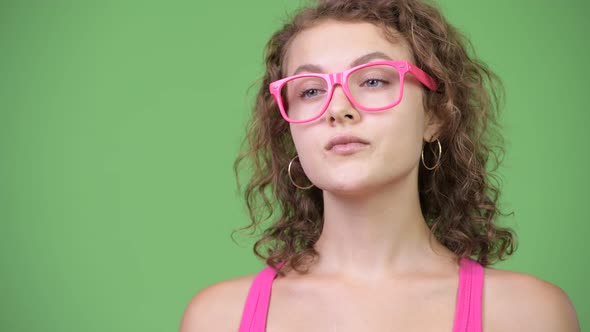 Young Beautiful Nerd Woman Thinking with Eyeglasses