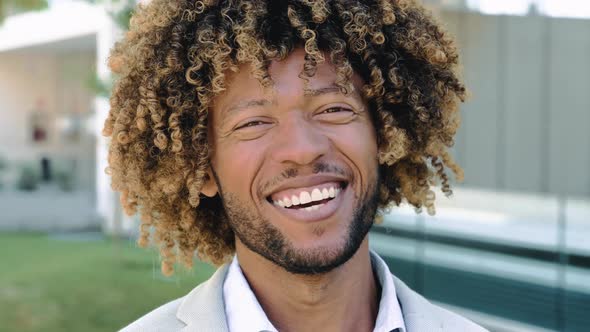 Closeup Video of a Handsome Attractive Positive African American or Brazilian Man with Curly Hair