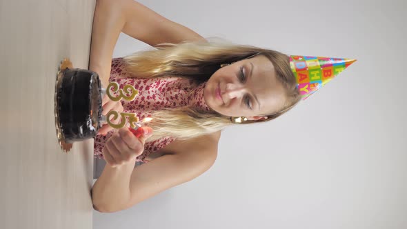 Woman Lighting Candles for Her Birthday