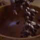 The Coffee Beans Fall on the Table in a Wooden Dish - VideoHive Item for Sale