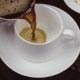 Hot Black Coffee Is Poured Into a White Cup - VideoHive Item for Sale