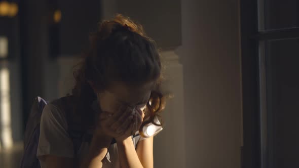 Sick Schoolgirl Putting Removing Facial Mask and Sneezing Standing in Corridor