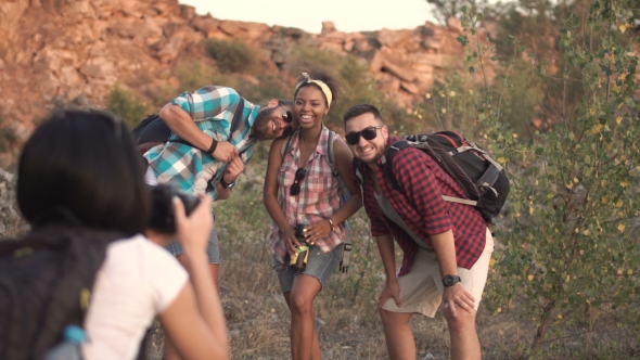 Anonymous Woman Taking Shot of Friends