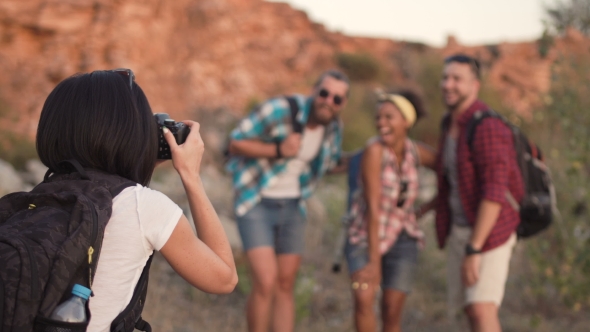 Girl Taking Photo of Friends While Traveling