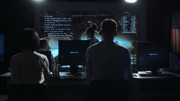People Working in Mission Control Center