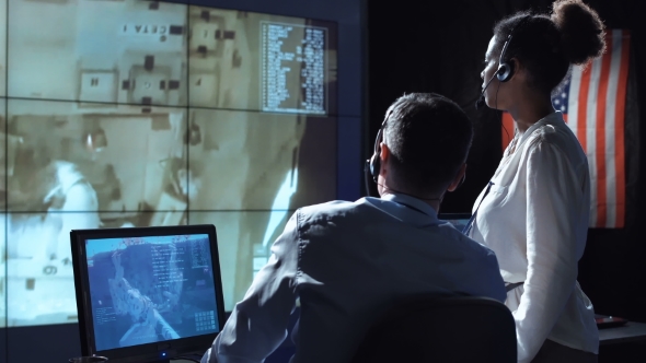 Scientists in Flight Control Center. Elements of This Image Furnished By NASA.