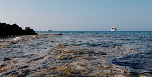 Blue Sea Rocks And Yacht
