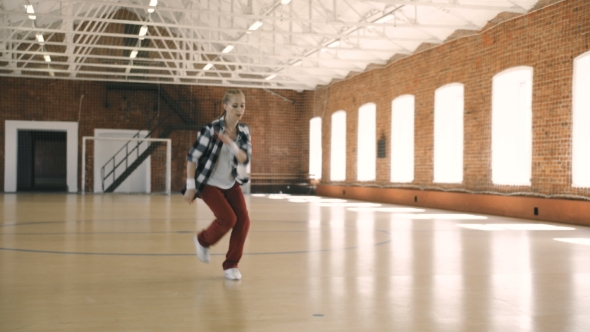 B-girl Dancing Breakdance in Sport Gym