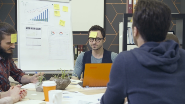 Group of Creative People Playng Game in Office