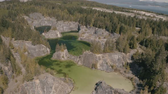 Beautiful Aerial View of the Colorful Lakes in the Canadian Nature during a sunny summer day. Taken