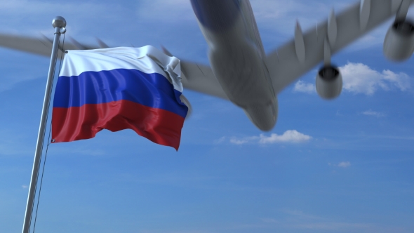 Commercial Airplane Landing Behind Waving Russian Flag