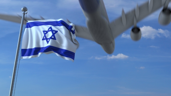 Commercial Airplane Landing Behind Waving Israeli Flag