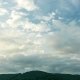 The Clouds Are Moving in Opposite Directions Over the Mountain - VideoHive Item for Sale