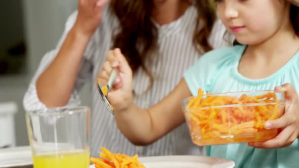 Mother and daughter having healthy meal