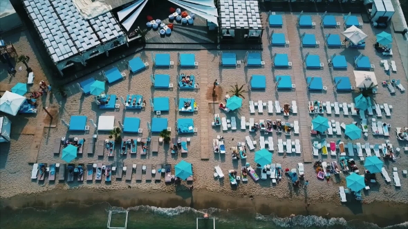 Aerial View of the Beach with Chaise-lounges.