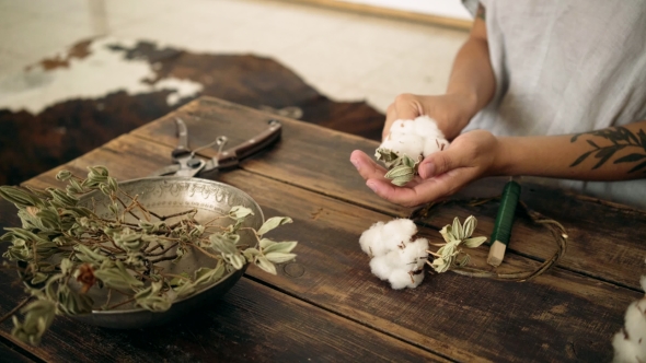 of Female Hands Work on Cotton Wreath