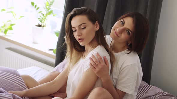 Two Happy Lesbian Luxuriate in Bed at Home