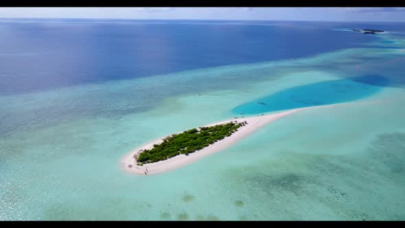 Aerial top down scenery of idyllic lagoon beach lifestyle by clear ocean and white sand background o