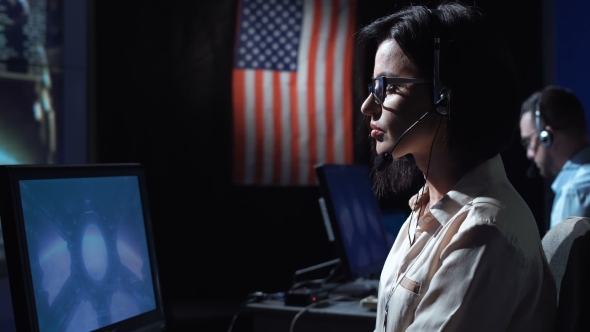 Woman at Computer in Flight Control Center